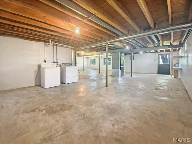 313 Pralle Ln, Saint Charles, MO 63303 - basement featuring washer and clothes dryer and heating unit
