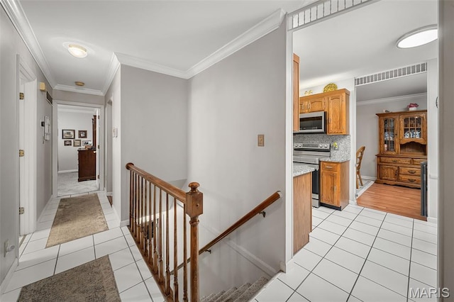 1615 Rosewall Dr Unit C, Saint Charles, MO 63303 - hall with light tile patterned floors, an upstairs landing, and ornamental molding