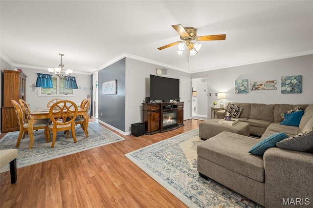 1615 Rosewall Dr Unit C, Saint Charles, MO 63303 - living area with wood finished floors, ornamental molding, a chandelier, and ceiling fan