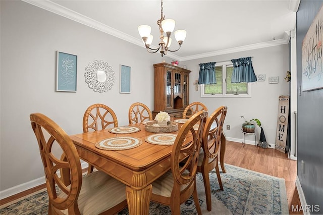 1615 Rosewall Dr Unit C, Saint Charles, MO 63303 - dining area with crown molding, a chandelier, and light wood-style flooring