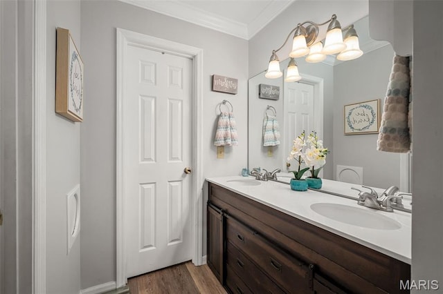 1615 Rosewall Dr Unit C, Saint Charles, MO 63303 - bathroom featuring double vanity, wood finished floors, and ornamental molding
