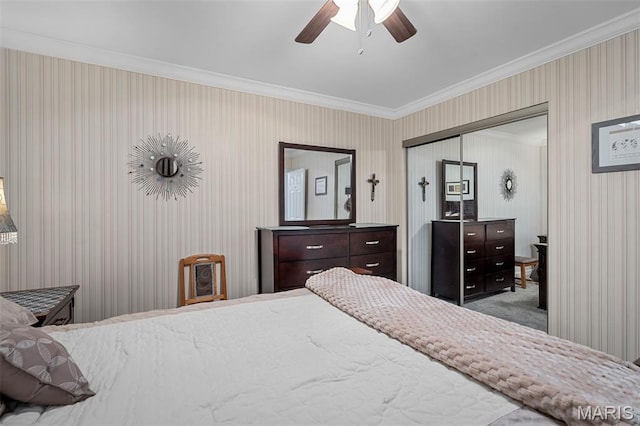 1615 Rosewall Dr Unit C, Saint Charles, MO 63303 - bedroom featuring a closet, crown molding, wallpapered walls, and a ceiling fan