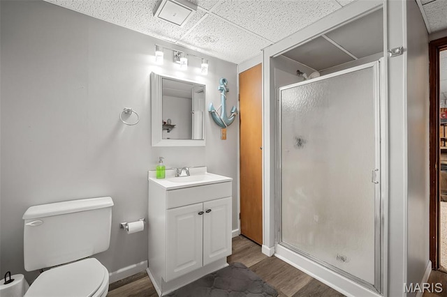1615 Rosewall Dr Unit C, Saint Charles, MO 63303 - bathroom featuring a paneled ceiling, vanity, a shower stall, and wood finished floors