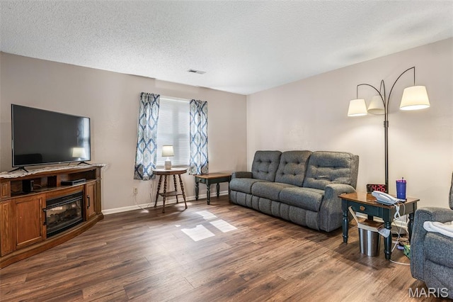 1121 N Desloge Dr Unit J-2, Desloge, MO 63601 - living room with dark wood-style floors and baseboards