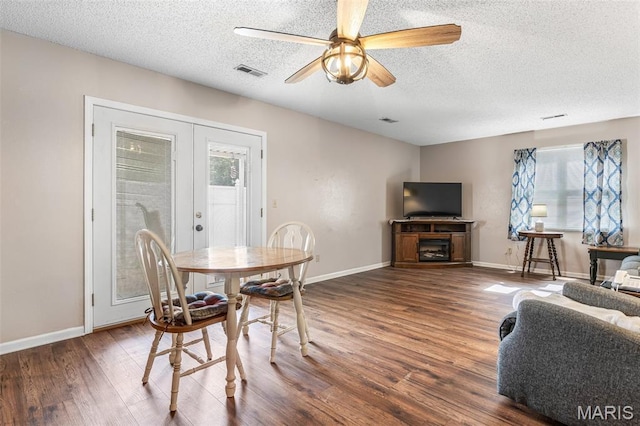 1121 N Desloge Dr Unit J-2, Desloge, MO 63601 - dining space with wood finished floors, a textured ceiling, ceiling fan, french doors, and baseboards