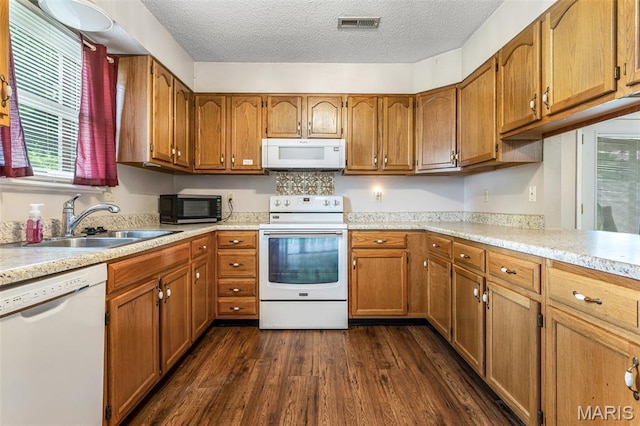 1121 N Desloge Dr Unit J-2, Desloge, MO 63601 - kitchen with white appliances, a sink, brown cabinets, light countertops, and a textured ceiling