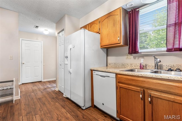 1121 N Desloge Dr Unit J-2, Desloge, MO 63601 - kitchen featuring white appliances, a sink, dark wood-style floors, light countertops, and a textured ceiling
