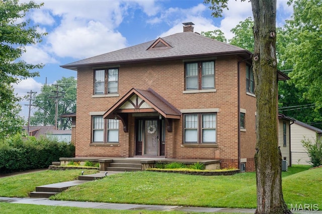 607 9th St, Highland, IL 62249 - view of front of home with brick siding, a chimney, a front lawn, and roof with shingles