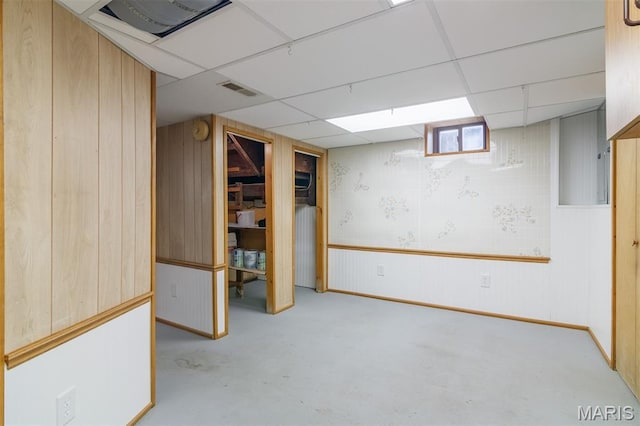 607 9th St, Highland, IL 62249 - basement with wood walls and a paneled ceiling