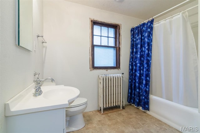 607 9th St, Highland, IL 62249 - bathroom featuring radiator, toilet, vanity, and shower / bathtub combination with curtain