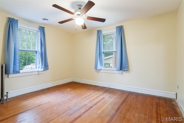 607 9th St, Highland, IL 62249 - spare room with wood finished floors and ceiling fan