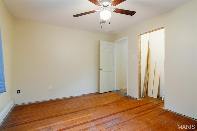 607 9th St, Highland, IL 62249 - unfurnished bedroom with light wood-style floors and a ceiling fan