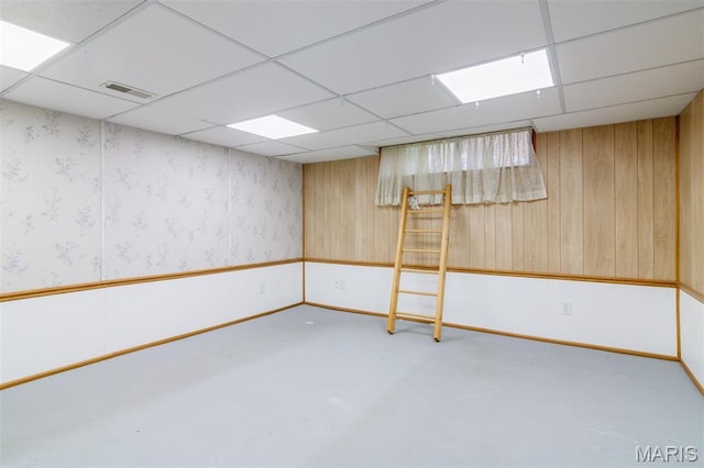 607 9th St, Highland, IL 62249 - finished basement with a drop ceiling and wood walls