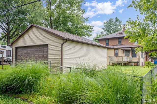 607 9th St, Highland, IL 62249 - view of property exterior with a garage and a wooden deck