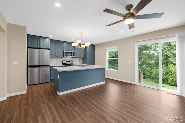 357 Newbridge Way, Ofallon, MO 63368 - kitchen featuring stainless steel appliances, a sink, a chandelier, light countertops, and backsplash