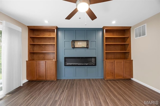 357 Newbridge Way, Ofallon, MO 63368 - unfurnished living room with dark wood-style flooring, a ceiling fan, healthy amount of natural light, baseboards, and recessed lighting