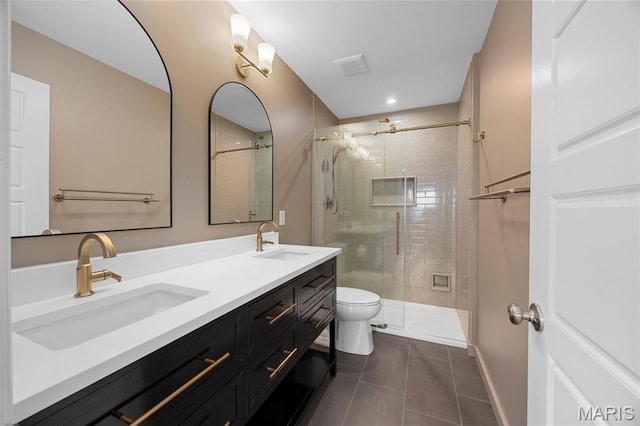 357 Newbridge Way, Ofallon, MO 63368 - bathroom with tile patterned flooring, toilet, double vanity, and a stall shower