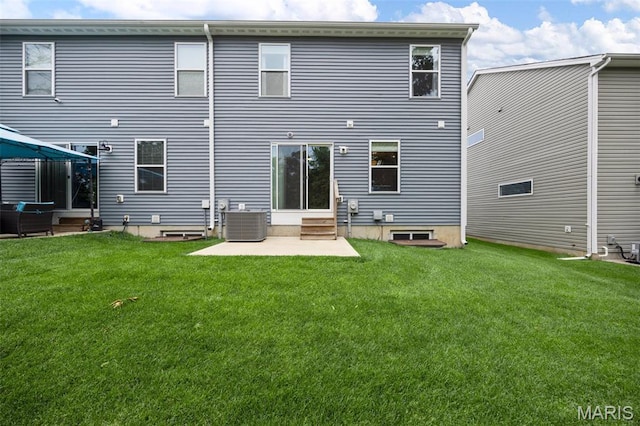 357 Newbridge Way, Ofallon, MO 63368 - back of house featuring a patio, entry steps, central AC, and a lawn