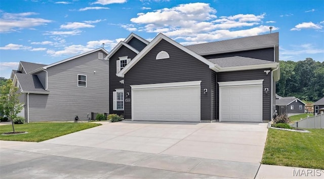 5034 Corisande Woods Dr, Fenton, MO 63026 - view of front facade featuring a garage, driveway, and a front lawn