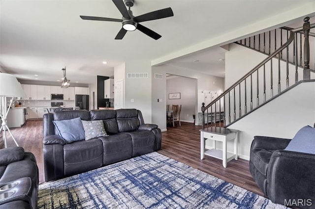 5034 Corisande Woods Dr, Fenton, MO 63026 - living area with stairway, wood finished floors, ceiling fan, and recessed lighting