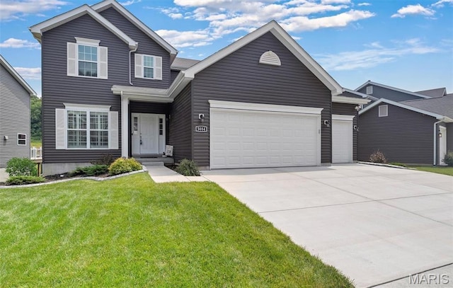 5034 Corisande Woods Dr, Fenton, MO 63026 - view of front of home with driveway, a front yard, and a garage