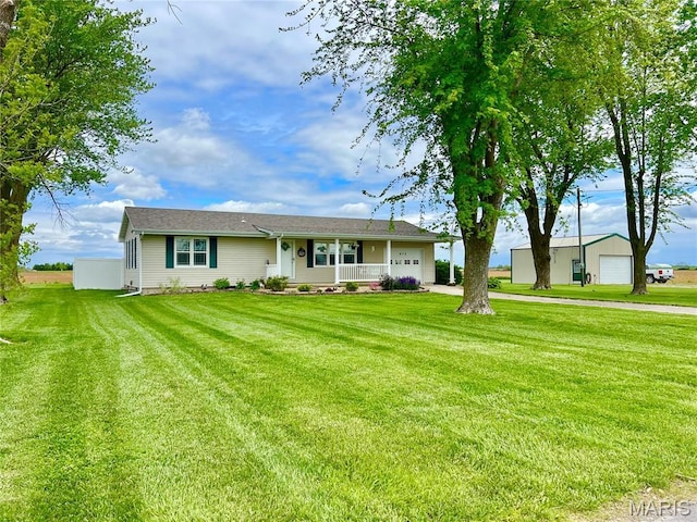 873 White Rd, Montgomery City, MO 63361 - view of front of property featuring a garage, covered porch, and a front yard