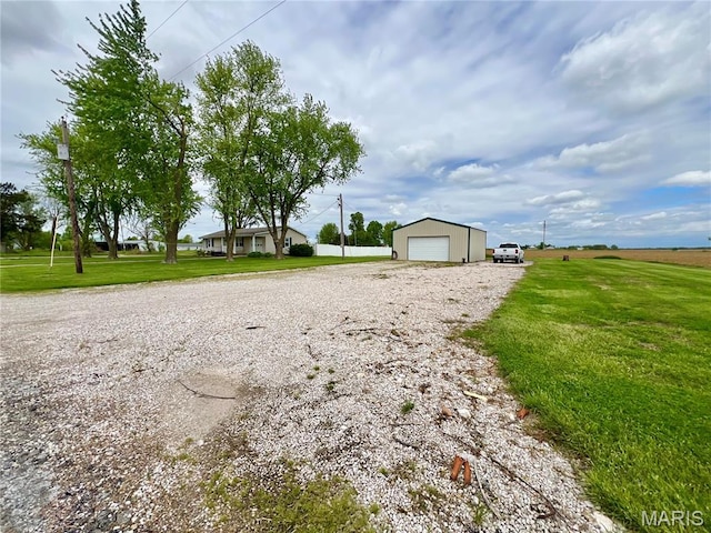 873 White Rd, Montgomery City, MO 63361 - view of grassy yard with a detached garage and an outdoor structure