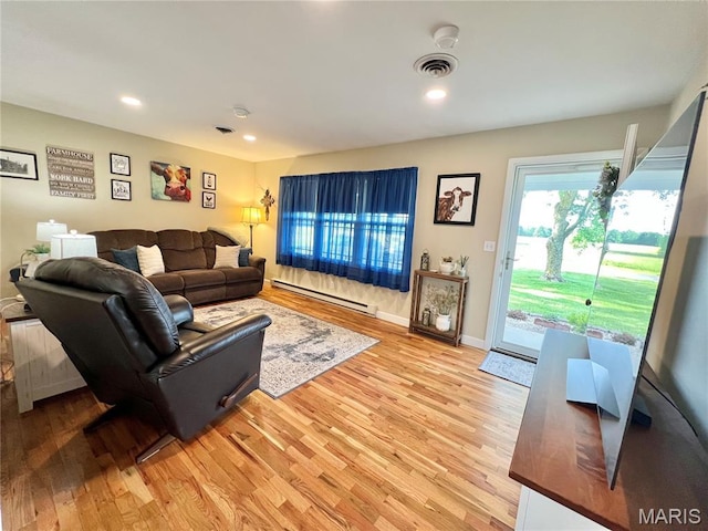 873 White Rd, Montgomery City, MO 63361 - living room with baseboard heating, light wood-style floors, and recessed lighting