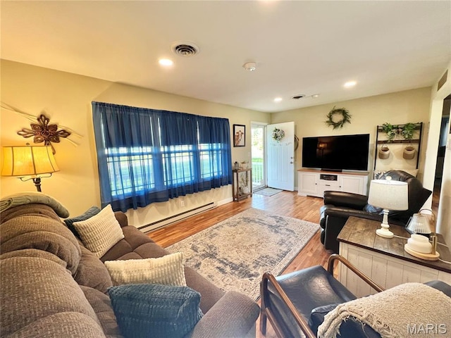 873 White Rd, Montgomery City, MO 63361 - living area with baseboard heating, wood finished floors, and recessed lighting
