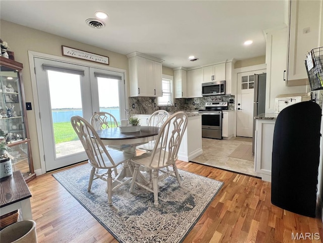 873 White Rd, Montgomery City, MO 63361 - dining room featuring french doors, light wood finished floors, and recessed lighting