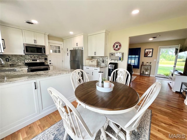 873 White Rd, Montgomery City, MO 63361 - dining room with light wood-style flooring and recessed lighting