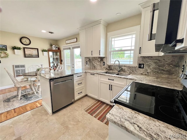 873 White Rd, Montgomery City, MO 63361 - kitchen with dishwasher, a peninsula, stove, white cabinets, and backsplash