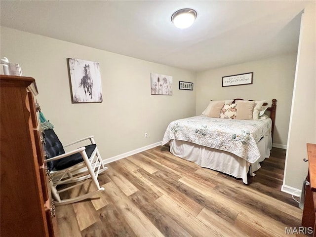 873 White Rd, Montgomery City, MO 63361 - bedroom with wood finished floors and baseboards