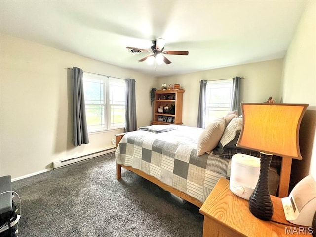 873 White Rd, Montgomery City, MO 63361 - bedroom featuring a baseboard heating unit, multiple windows, carpet flooring, and ceiling fan