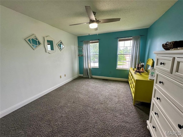 5213 Loyola Ct, Fairview Heights, IL 62208 - bedroom with a textured ceiling, dark colored carpet, baseboards, and a ceiling fan
