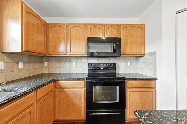429 Red Coat Trl, Wentzville, MO 63385 - kitchen featuring black appliances, dark stone countertops, and backsplash