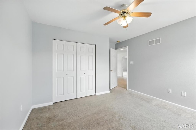 429 Red Coat Trl, Wentzville, MO 63385 - unfurnished bedroom with carpet, a closet, and a ceiling fan