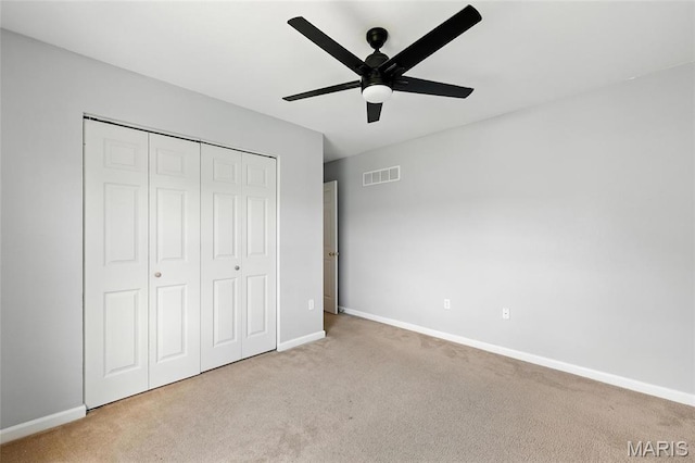 429 Red Coat Trl, Wentzville, MO 63385 - unfurnished bedroom with carpet, a closet, and a ceiling fan