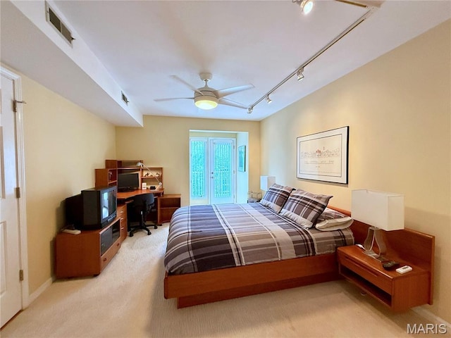 4235 W Pine Blvd Unit 21, Saint Louis, MO 63108 - bedroom featuring a desk, carpet flooring, track lighting, a ceiling fan, and baseboards