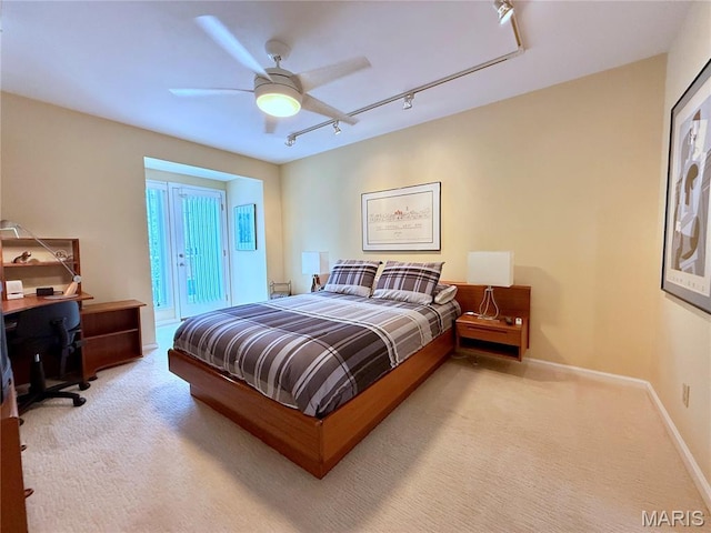 4235 W Pine Blvd Unit 21, Saint Louis, MO 63108 - bedroom featuring rail lighting, carpet floors, an office area, a ceiling fan, and baseboards