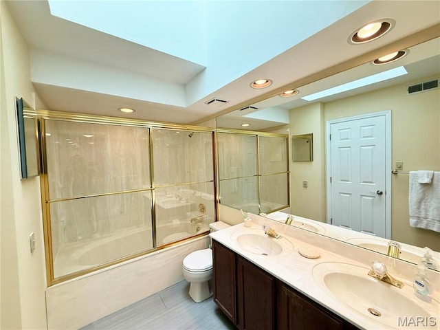 4235 W Pine Blvd Unit 21, Saint Louis, MO 63108 - full bath with toilet, bath / shower combo with glass door, double vanity, and recessed lighting