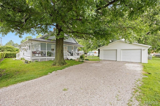 203 N Williams St, Albers, IL 62215 - view of front of property with an outdoor structure, covered porch, a front yard, and a garage