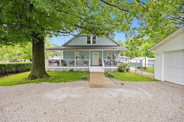 203 N Williams St, Albers, IL 62215 - farmhouse-style home featuring a porch, driveway, and a garage
