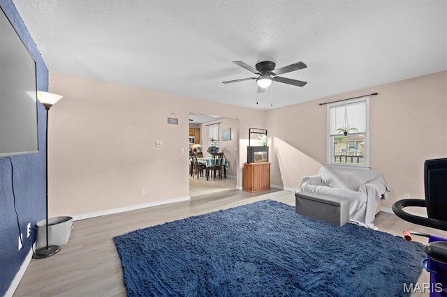 203 N Williams St, Albers, IL 62215 - sitting room with ceiling fan, wood finished floors, baseboards, and a textured ceiling