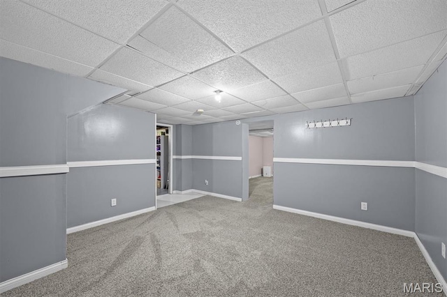 203 N Williams St, Albers, IL 62215 - finished below grade area featuring a drop ceiling, carpet floors, and baseboards