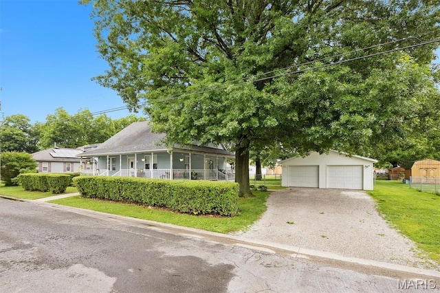 203 N Williams St, Albers, IL 62215 - view of front of house with an outbuilding, a garage, and a porch