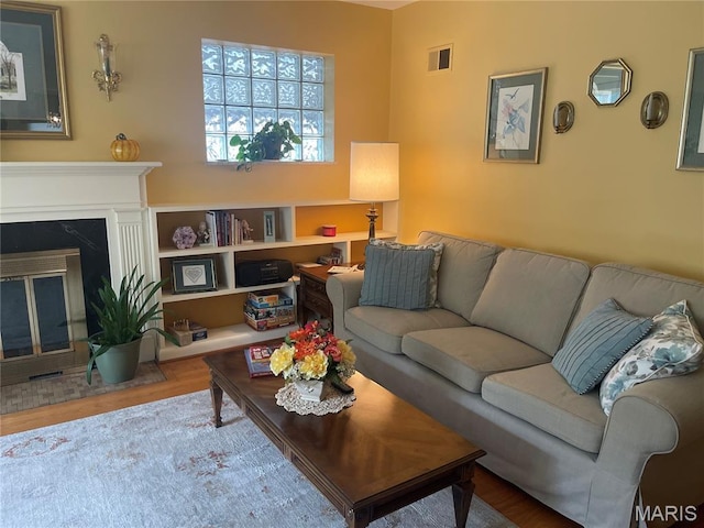 1034 Chelsea Ave, Glendale, MO 63122 - living room featuring wood finished floors and a high end fireplace