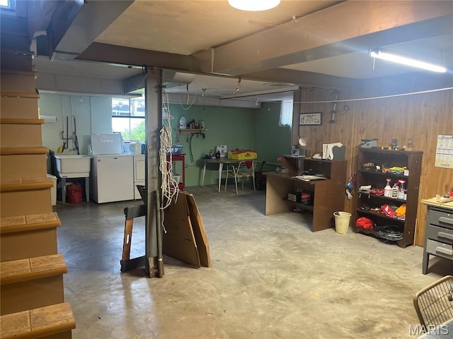 1034 Chelsea Ave, Glendale, MO 63122 - below grade area with washing machine and dryer, plenty of natural light, and a workshop area