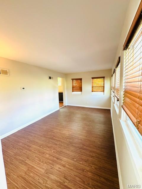 1928 Arsenal St, Saint Louis, MO 63118 - spare room with dark wood-style flooring and baseboards