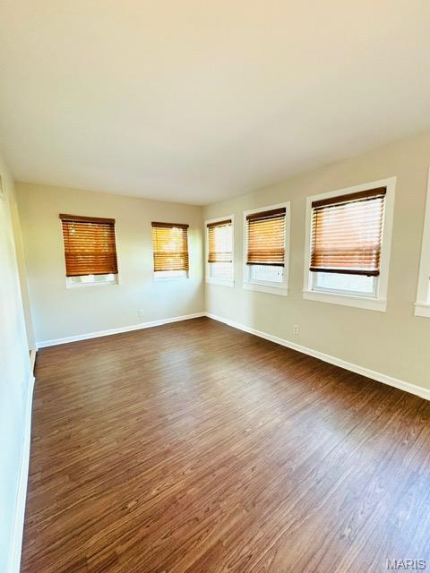1928 Arsenal St, Saint Louis, MO 63118 - unfurnished room featuring dark wood-style floors and baseboards